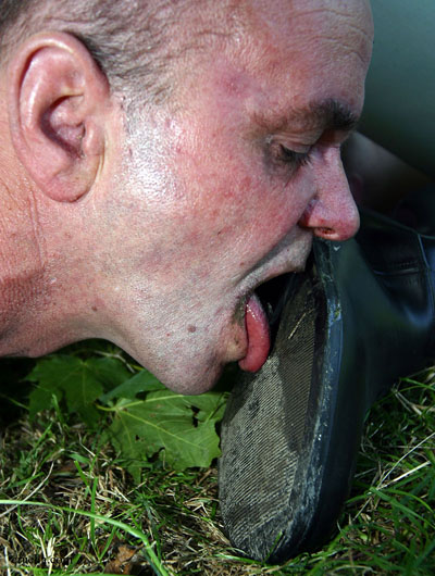 Outdoor muddy boot soles licking