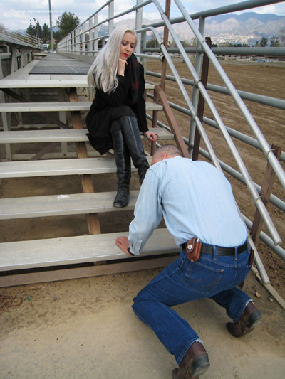 Licking the dirt from Mistress Ezber's boots at the stables