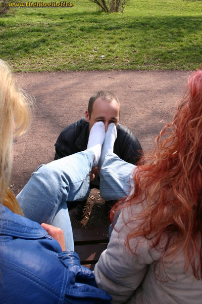 Foot slave sniffs the sweaty socks of 2 Ladies