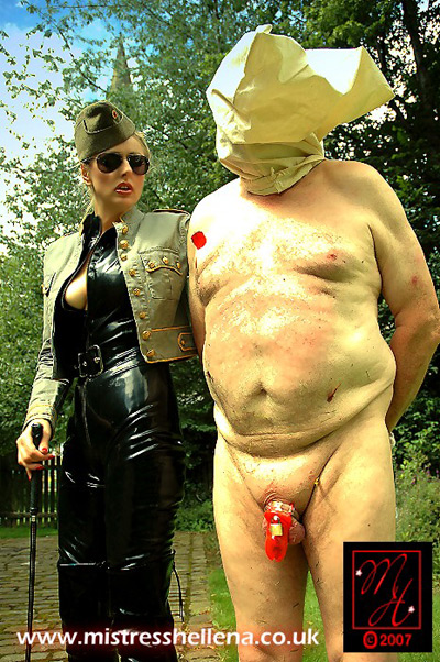 Officer Hellena brings her chastitised slave for public punishment